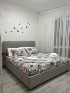 a bedroom with a bed with books on it at Garden Lake Apartment in Peschiera del Garda