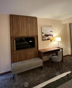 a hotel room with a desk and a desk and a computer at Comfort sky Hotel11 in Cairo +12 photos