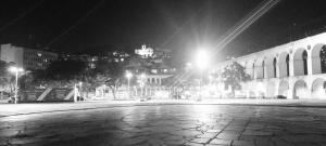a city street at night with a building with lights at Lapa Casa Hostel in Rio de Janeiro