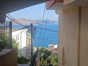 a view of the ocean from a building at Duplex on Fifth in Sarandë