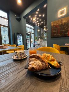 a table with a plate of bread and a cup of coffee at blu sea in La Spezia