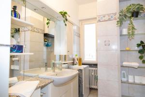a bathroom with a sink and a mirror at Casa Angelika near Milan, Malpensa, Rho Fiera in Legnano +19 photos