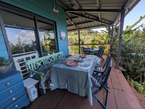 a table on the porch of a house at Case entre2containers in LʼEntre-Deux