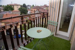 a slice of pizza sitting on a table on a balcony at Casa Angelika near Milan, Malpensa, Rho Fiera in Legnano