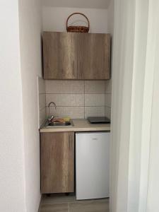 Η κουζίνα ή μικρή κουζίνα στο Asijaapartmani