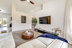 a living room with a white couch and a table at 7 Mi to Dtwn Charming Retreat with Yard in Boise in Boise