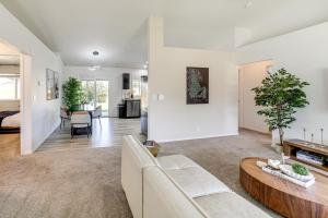 a living room with a couch and a table at 7 Mi to Dtwn Charming Retreat with Yard in Boise in Boise