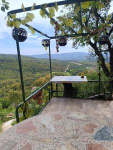 a balcony with a table and a view at habitacion a 15 min playa d aro in Romanyá de la Selva