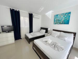 Letto o letti in una camera di OLAS DE SOL CARIBE playa LOS CORALES