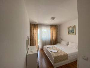 Postel nebo postele na pokoji v ubytování Hotel Xanadu