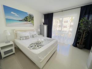 Letto o letti in una camera di OLAS DE SOL CARIBE playa LOS CORALES
