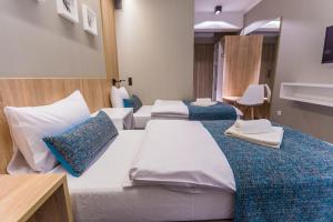 Posteľ alebo postele v izbe v ubytovaní Hotel Falcon