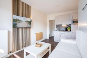 Kuchyň nebo kuchyňský kout v ubytování Das Solaris 18 Beach Apartment mit Gemeinschaftssauna und Grillplatz
