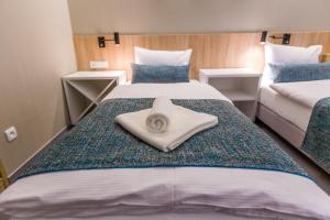 Posteľ alebo postele v izbe v ubytovaní Hotel Falcon