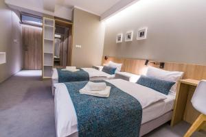Posteľ alebo postele v izbe v ubytovaní Hotel Falcon