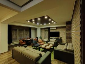 a large living room with couches and a table and chairs at Villa Sarajevo Heights ex Villa Kolonija in Sarajevo