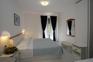 Postel nebo postele na pokoji v ubytování Hotel Valle Verde