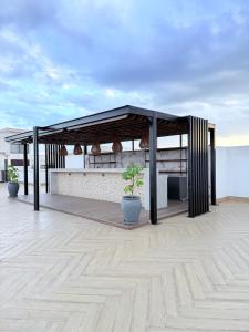 a pavilion on the roof of a building at M&D Zenith Place in Nairobi +61 photos