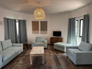 a living room with couches and a coffee table at Balsamaris in Manta Rota