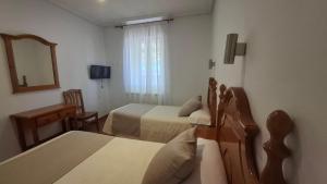 TV a/nebo společenská místnost v ubytování Hostal Bellas