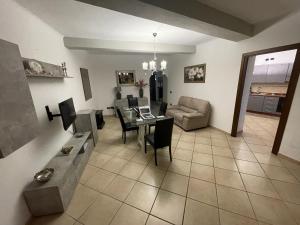 a living room with a table and a couch at La Rocchetta in Sutri