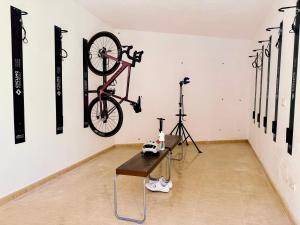 a bike hanging on a wall in a room at Agroturismo Son Galceran in Esporles