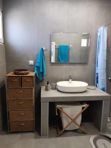 a bathroom with a sink and a mirror at Myrovolos in Armenistis +29 photos