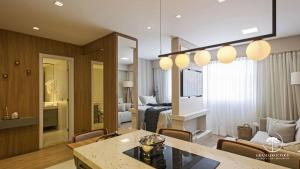 a living room with a kitchen and a room with a living room at Modern apt next to Criamigos Park + coffee Day 1 in Gramado +37 photos