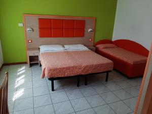 Postel nebo postele na pokoji v ubytování Hotel Consul