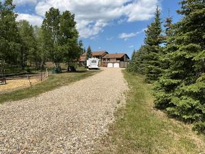 a gravel road in front of a house at Tudor House Bed and Breakfast in Bottrel