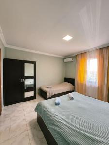Letto o letti in una camera di Guest House "Sulo"