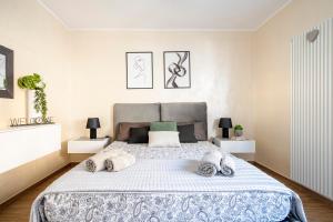 a bedroom with a large bed with pillows at DaDa Luxury Home in Bari