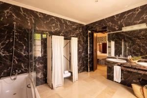 a bathroom with two sinks and a shower at Agroturismo Son Galceran in Esporles +38 photos