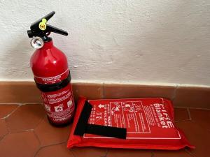 a fire extinguisher and a fire hydrant next to a fire extinguisher at Authentic Ramatuelle Village House in Ramatuelle
