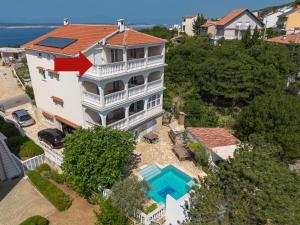 an aerial view of a house with a swimming pool at Kuca Orhidea in Crikvenica