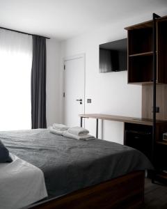 Postel nebo postele na pokoji v ubytování Fole Apart Hotel