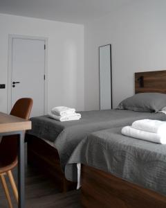Postel nebo postele na pokoji v ubytování Fole Apart Hotel