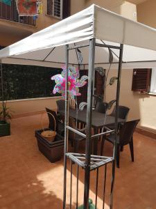 a table with a white canopy in a room at Bea&B in Rome