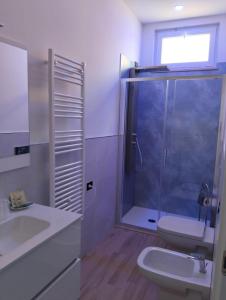 a bathroom with a shower and a toilet and a sink at Fishermen Bros in Francavilla al Mare +14 photos