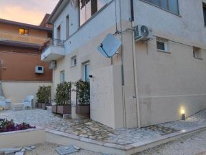 a building with a door on the side of it at Fishermen Bros in Francavilla al Mare