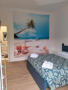 a bedroom with a bed with a painting on the wall at Fishermen Bros in Francavilla al Mare +14 photos
