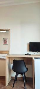 TV a/nebo společenská místnost v ubytování Duka Rooms