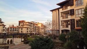 a group of apartment buildings in a city at Premium Oasis Beach Club Apartment in Lozenets