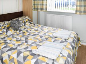 Ένα ή περισσότερα κρεβάτια σε δωμάτιο στο Sundance