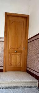 a wooden door in the middle of a room at Malteses in A Guarda +1 photo