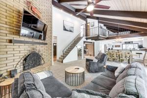 a living room with a couch and a fireplace at Private Hot Tub at Dog-Friendly Lake Arrowhead Gem in Lake Arrowhead