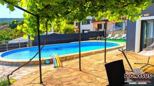 The swimming pool at or close to Arode Villa Dionysus