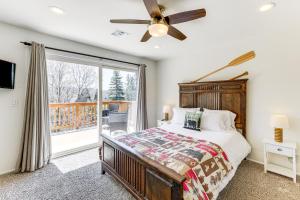 a bedroom with a bed and a large window at Private Hot Tub at Dog-Friendly Lake Arrowhead Gem in Lake Arrowhead