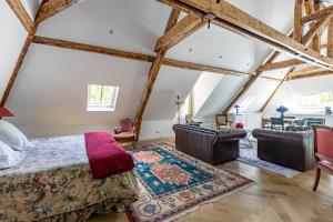 a bedroom with a bed and a living room at Casa La Palma Le 48 in Soissons +56 photos