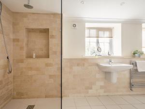 a bathroom with a sink and a shower at Westhill House in Warkworth +20 photos